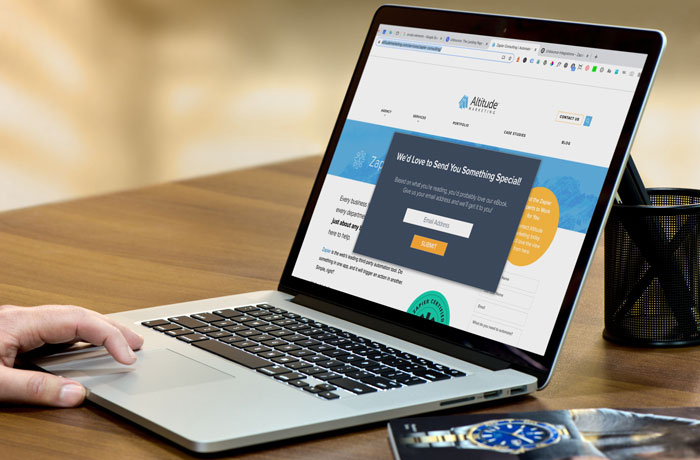 You can use Unbounce to build popups and sticky bars.
