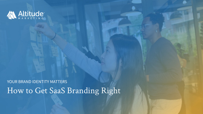 How to Get SaaS Branding Right: Image of marketers collaborating with a white board and sticky notes to figure out their brand identity 