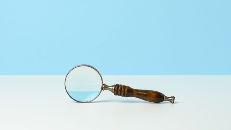 Featured Image for Competitor Research post, featuring a magnifying glass