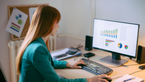 Girl typing on computer for market research