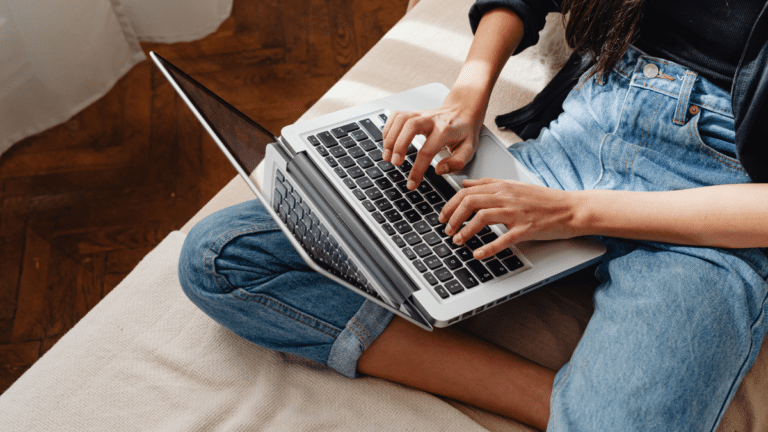 person typing on their computer